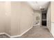 Spacious loft area featuring neutral carpeting and doorway access to bedrooms at 1367 S Country Club Dr # 1295, Mesa, AZ 85210