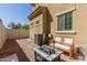 Cozy outdoor patio area featuring a fire pit, seating, and comfortable space at 1367 S Country Club Dr # 1295, Mesa, AZ 85210
