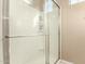 Shower with glass door and white tile surround at 1367 S Country Club Dr # 1295, Mesa, AZ 85210