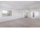 Large primary bedroom with several windows, a ceiling fan, and access to the bathroom and closet at 1430 E Douglas St, Casa Grande, AZ 85122