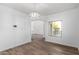 Inviting dining space with ample light, modern light fixture, and wood-look flooring at 1430 E Douglas St, Casa Grande, AZ 85122