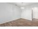 A spacious dining room with modern lighting and wood-look floors, perfect for entertaining guests at 1430 E Douglas St, Casa Grande, AZ 85122