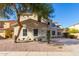 Charming two-story home featuring stucco siding, desert landscaping, and a spacious front yard at 1430 E Douglas St, Casa Grande, AZ 85122