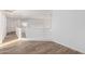 Upstairs hallway featuring a white railing that overlooks the space below and neutral wood-style flooring at 1430 E Douglas St, Casa Grande, AZ 85122