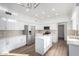 Functional kitchen showcasing white cabinets, stainless steel appliances, and modern lighting at 1430 E Douglas St, Casa Grande, AZ 85122