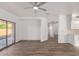 Open living room with ample light, wood-look flooring, and a seamless connection to outdoor spaces at 1430 E Douglas St, Casa Grande, AZ 85122