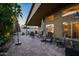 Spacious back patio with ample seating, perfect for relaxing and entertaining guests outdoors at 15149 W Vale Dr, Goodyear, AZ 85395