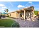 Landscaped backyard with spacious patio, artificial turf, and outdoor seating, ideal for relaxation at 15149 W Vale Dr, Goodyear, AZ 85395