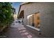 Cozy backyard with a charming patio area, lush greenery, and a stepping stone path at 15149 W Vale Dr, Goodyear, AZ 85395