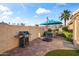 Outdoor kitchen with BBQ area and dining with a stop sign detail at 15149 W Vale Dr, Goodyear, AZ 85395