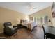 Inviting bedroom with a vaulted ceiling, ceiling fan, and a comfortable layout with natural light at 15149 W Vale Dr, Goodyear, AZ 85395
