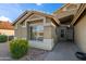 Charming single-story home featuring desert landscaping, tiled roof, and decorative accents at 15149 W Vale Dr, Goodyear, AZ 85395