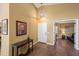 Welcoming foyer with tile flooring, a pendant light, and views of the living spaces at 15149 W Vale Dr, Goodyear, AZ 85395