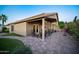 Spacious covered patio with brick flooring and comfortable seating, perfect for outdoor entertaining at 15149 W Vale Dr, Goodyear, AZ 85395