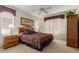 Cozy bedroom with a ceiling fan, and natural light from the window at 15885 W Remington Dr, Surprise, AZ 85374