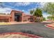 Beautiful community clubhouse featuring desert landscaping, a charming building, and easy parking at 15885 W Remington Dr, Surprise, AZ 85374