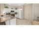 Functional kitchen with granite counters, white cabinetry, and modern appliances at 15885 W Remington Dr, Surprise, AZ 85374