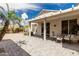 Inviting patio space with outdoor seating, surrounded by a beautifully maintained desert landscape at 15885 W Remington Dr, Surprise, AZ 85374