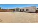 Expansive backyard space with enclosed porch and block wall for privacy at 16034 W Carmen Dr, Surprise, AZ 85374