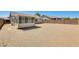 View of a large backyard featuring an enclosed patio ready for landscaping at 16034 W Carmen Dr, Surprise, AZ 85374