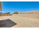 Expansive backyard enclosed by block wall perfect for creating an outdoor space at 16034 W Carmen Dr, Surprise, AZ 85374