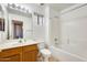 Bright bathroom with a vanity, toilet, shower and tub combination, perfect for relaxation and convenience at 16034 W Carmen Dr, Surprise, AZ 85374