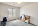 Cozy bedroom featuring a window, neutral carpet, and ample space at 16034 W Carmen Dr, Surprise, AZ 85374