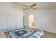 Spacious bedroom features a ceiling fan and closet providing ample space and comfort at 16034 W Carmen Dr, Surprise, AZ 85374