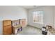 Bright bedroom with large window, neutral carpet, and ample natural light at 16034 W Carmen Dr, Surprise, AZ 85374