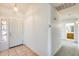 Open entryway with tile flooring, leading to carpeted areas and showcasing a bright, welcoming ambiance at 16034 W Carmen Dr, Surprise, AZ 85374