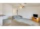 Comfortable living room with neutral tones, ceiling fan, and plush carpeting at 16034 W Carmen Dr, Surprise, AZ 85374