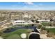 Aerial view showcasing the community's golf course, clubhouse, and surrounding residential area at 16769 W Brookhaven Ct, Surprise, AZ 85387