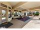 Spacious covered patio featuring outdoor seating, seamlessly blending indoor and outdoor living spaces at 16769 W Brookhaven Ct, Surprise, AZ 85387