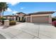 Beautiful home with a three car garage and landscaped front yard and tiled roof at 16769 W Brookhaven Ct, Surprise, AZ 85387