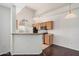 Modern kitchen with stainless steel appliances, light wood cabinets, and bar seating area at 17017 N 12Th St # 2012, Phoenix, AZ 85022