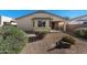 Spacious backyard featuring desert landscaping, a covered patio and privacy block wall at 18222 E La Posada Ct, Gold Canyon, AZ 85118