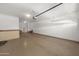 Spacious garage with sealed concrete floor, featuring high ceilings for extra storage at 18222 E La Posada Ct, Gold Canyon, AZ 85118
