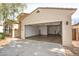 Spacious two car garage featuring sealed concrete floor and high ceilings for storage at 18222 E La Posada Ct, Gold Canyon, AZ 85118