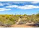 Community gazebo surrounded by desert vegetation and a sunny sky at 18222 E La Posada Ct, Gold Canyon, AZ 85118