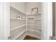 Walk-in pantry with white shelving, providing ample storage space in the kitchen area at 18222 E La Posada Ct, Gold Canyon, AZ 85118