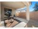 Covered patio area with desert landscaping featuring a small table and chairs set at 18222 E La Posada Ct, Gold Canyon, AZ 85118