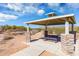 Covered picnic area with stone columns and a mountain backdrop at 18222 E La Posada Ct, Gold Canyon, AZ 85118
