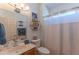 Cozy bathroom features a sink, toilet, and shower, offering functionality and comfort at 19615 N Sunburst Way, Surprise, AZ 85374
