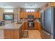 Spacious kitchen with stainless steel appliances, granite countertops, and ample storage space at 19615 N Sunburst Way, Surprise, AZ 85374