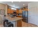 Well-equipped kitchen featuring granite countertops, stainless steel appliances, and ample cabinet space at 19615 N Sunburst Way, Surprise, AZ 85374