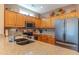 Well-lit kitchen boasting stainless steel appliances, granite countertops, and ample storage at 19615 N Sunburst Way, Surprise, AZ 85374