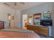 Comfortable main bedroom boasts stylish furniture, modern decor and ensuite bathroom access at 19615 N Sunburst Way, Surprise, AZ 85374