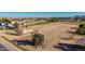 Spacious land with existing home, offering vast development opportunities against a backdrop of city and mountains at 20521 E Germann Rd, Queen Creek, AZ 85142