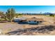 Expansive property featuring a charming home and spacious land with mountain views against a clear blue sky at 20521 E Germann Rd, Queen Creek, AZ 85142
