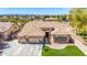 Aerial view of single Gathering home with artificial grass, paver patio and desert landscaping at 20540 N 86Th Ln, Peoria, AZ 85382